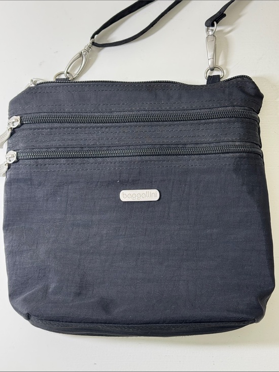 Baggallini Handbags - Baggalini black nylon crossbody bag with matching integrated mini bag/wallet.